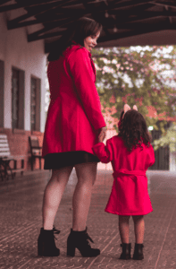 woman and daughter in red coats